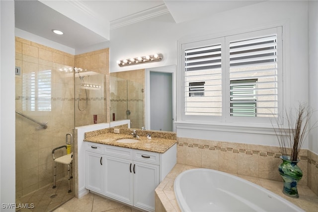 bathroom featuring vanity, ornamental molding, tile patterned floors, and shower with separate bathtub