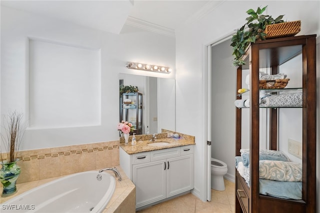 bathroom with tile patterned floors, toilet, crown molding, vanity, and tiled bath