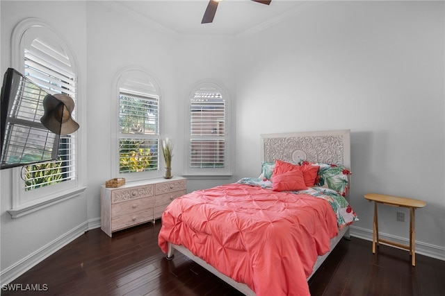 bedroom featuring ceiling fan, ornamental molding, and dark hardwood / wood-style flooring