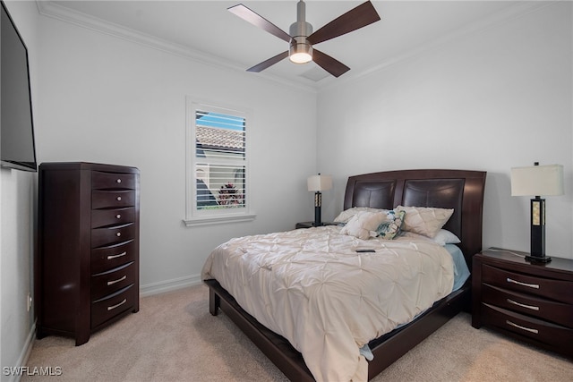 bedroom featuring ornamental molding, light carpet, and ceiling fan