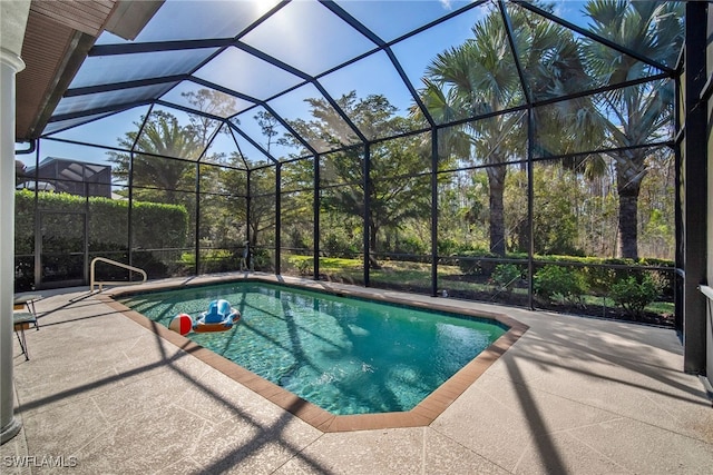 view of pool featuring a patio and glass enclosure