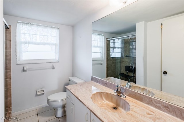 bathroom featuring vanity, a shower with shower door, tile patterned floors, and toilet