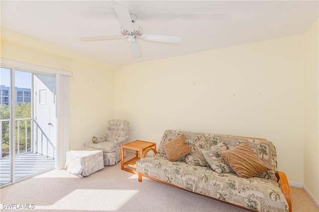 sitting room featuring ceiling fan and carpet