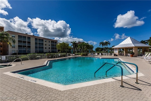 view of swimming pool with a gazebo and a patio area