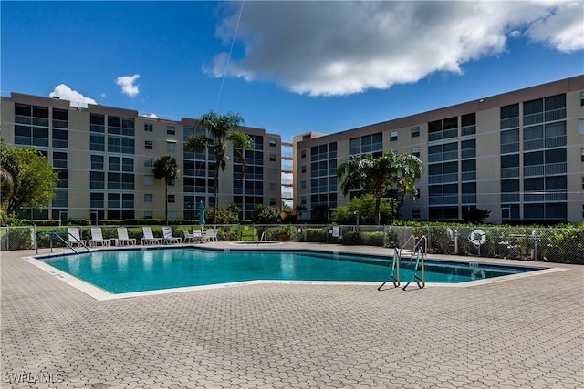 view of swimming pool featuring a patio area