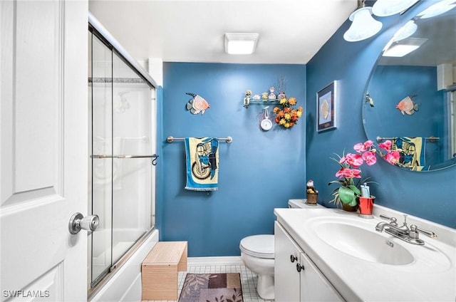 full bathroom with vanity, tile patterned flooring, toilet, and combined bath / shower with glass door