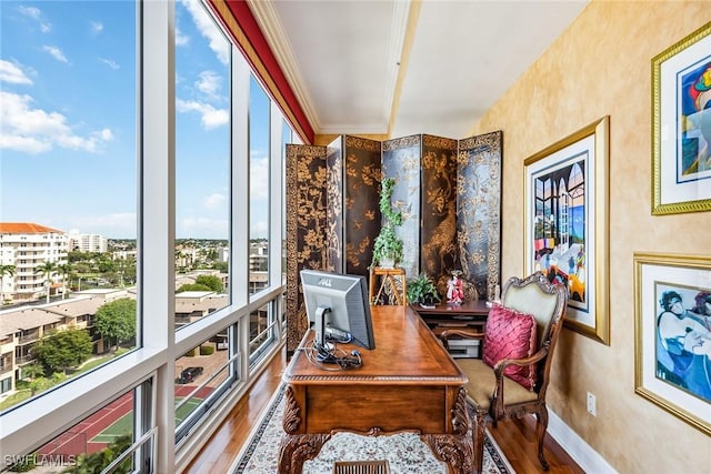 home office featuring hardwood / wood-style flooring and crown molding