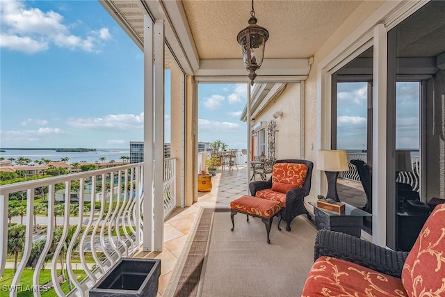 sunroom / solarium with a water view