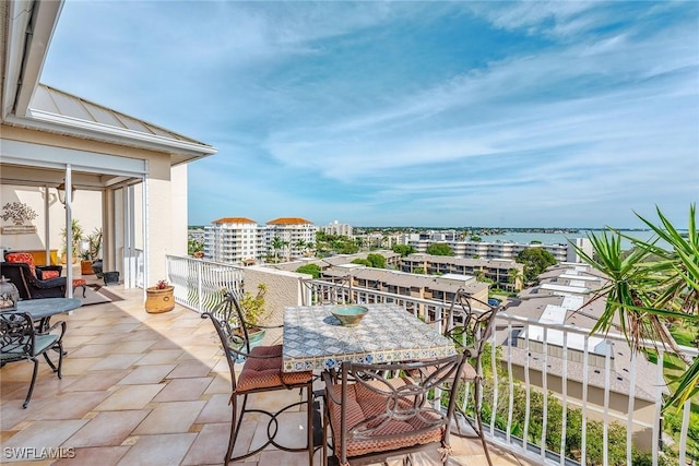 balcony featuring a water view