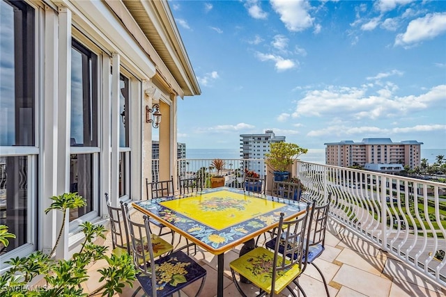 balcony featuring a water view