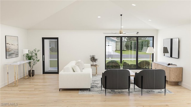 living room featuring ceiling fan, high vaulted ceiling, and light hardwood / wood-style floors