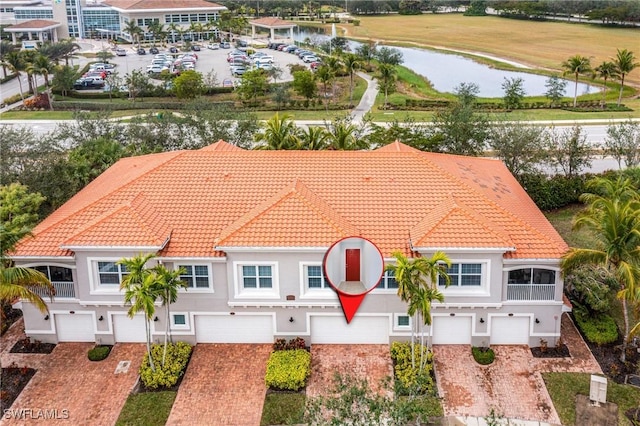 birds eye view of property featuring a water view