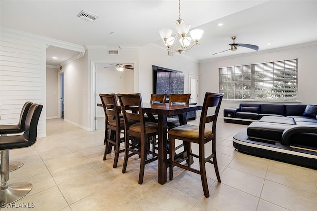 tiled dining space with ornamental molding and ceiling fan