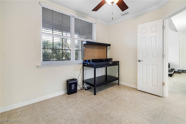 misc room with light tile patterned flooring, ceiling fan, and crown molding