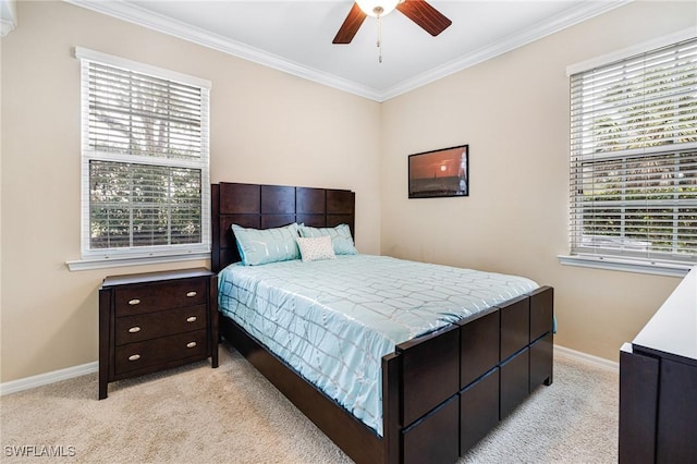 carpeted bedroom with multiple windows, crown molding, and ceiling fan