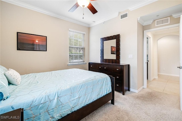 bedroom featuring crown molding, light colored carpet, and ceiling fan