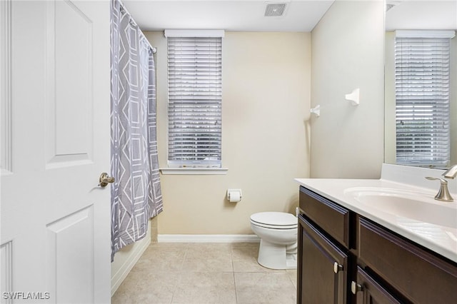 full bathroom with toilet, vanity, shower / bathtub combination with curtain, and tile patterned flooring