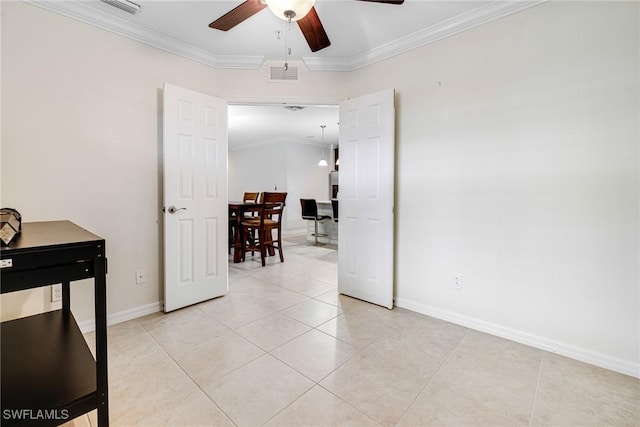 interior space with ornamental molding and ceiling fan