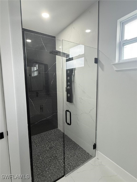 bathroom with an enclosed shower