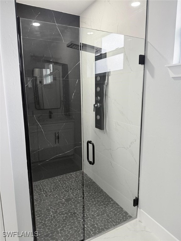 bathroom with an enclosed shower