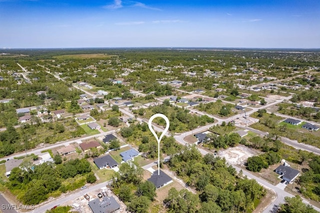3702 Flora Ave N, Lehigh Acres, FL 33971 - aerial view of property and surrounding area with nearby suburban area
