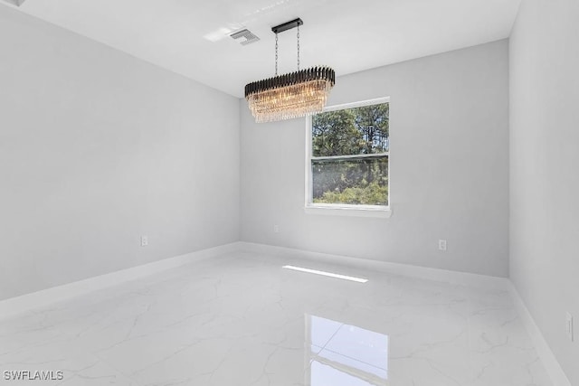 3702 Flora Ave N, Lehigh Acres, FL 33971 - unfurnished room featuring marble tiled floors, a chandelier, and baseboards