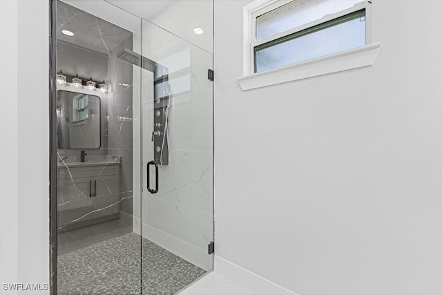 3702 Flora Ave N, Lehigh Acres, FL 33971 - bathroom featuring a stall shower, baseboards, and marble finish flooring