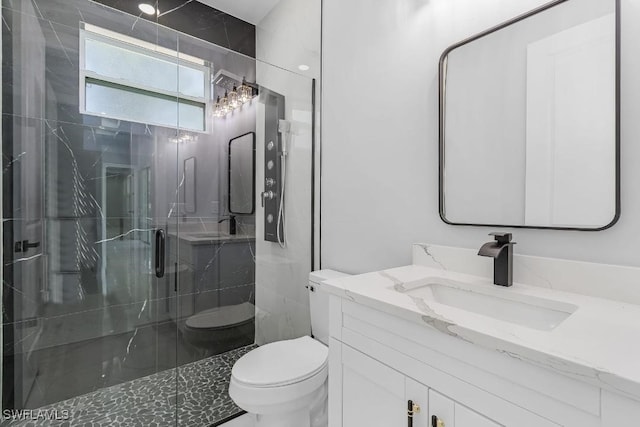 3702 Flora Ave N, Lehigh Acres, FL 33971 - full bath featuring toilet, a marble finish shower, and vanity