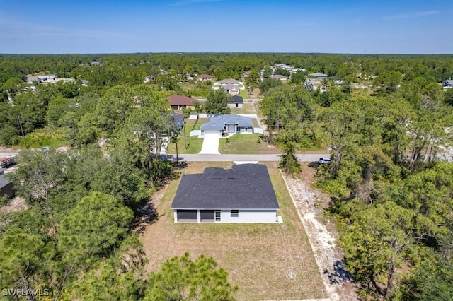3702 Flora Ave N, Lehigh Acres, FL 33971 - aerial view of a heavily wooded area