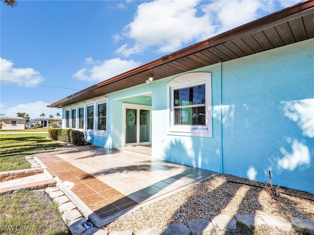 rear view of property featuring a patio