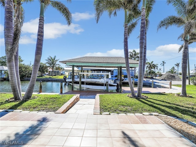 dock area with a water view and a yard