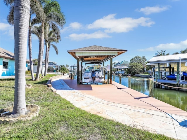 view of dock featuring a water view and a lawn