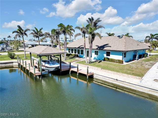 dock area featuring a yard and a water view