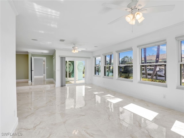 interior space featuring ceiling fan and ornamental molding