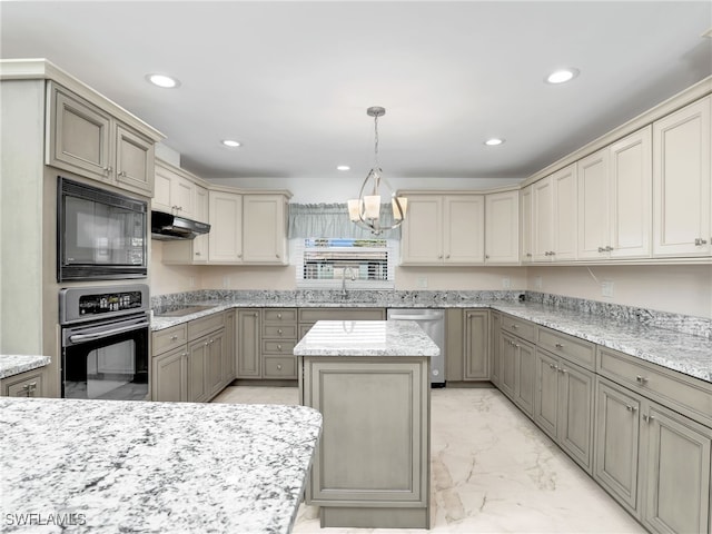 kitchen featuring sink, a center island, pendant lighting, light stone countertops, and black appliances