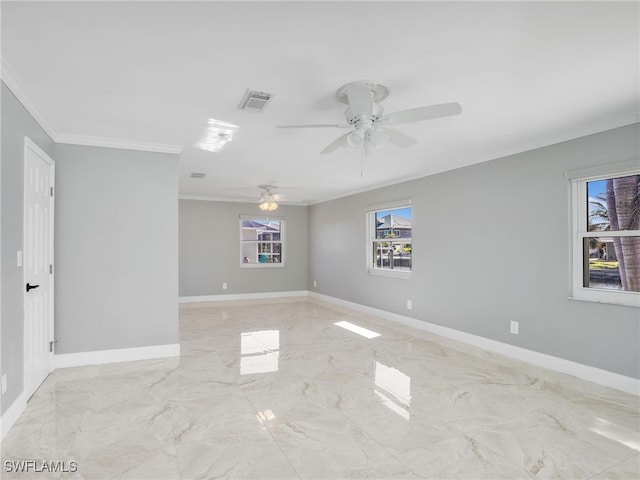 empty room with ornamental molding and ceiling fan