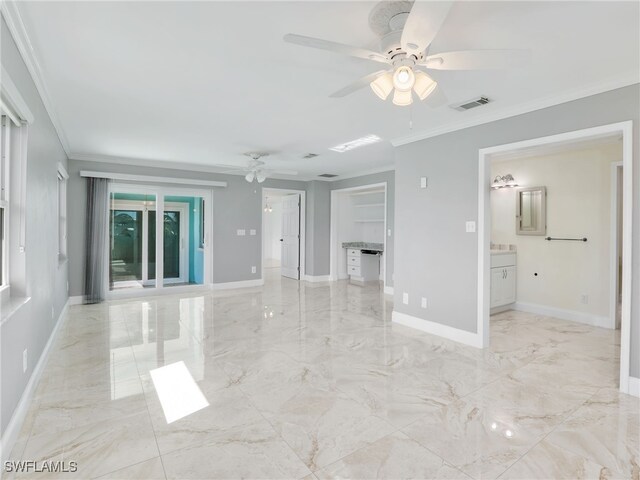 unfurnished room with ornamental molding and ceiling fan