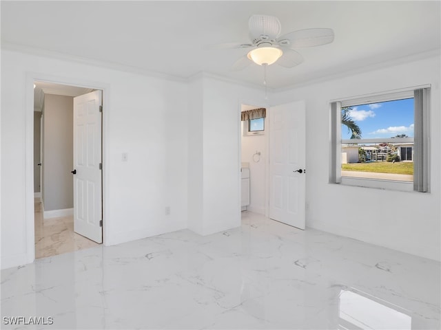 spare room featuring crown molding and ceiling fan