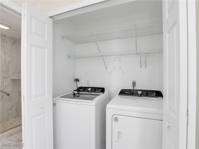 washroom with washer and dryer