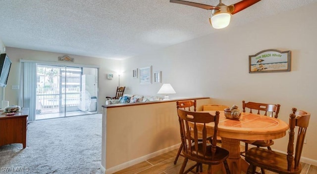 dining room featuring a textured ceiling