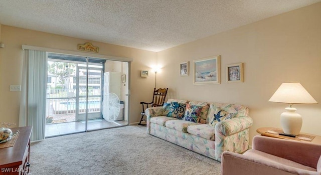 carpeted living room featuring a textured ceiling