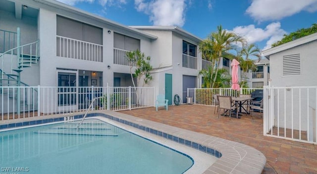 view of swimming pool featuring a patio area