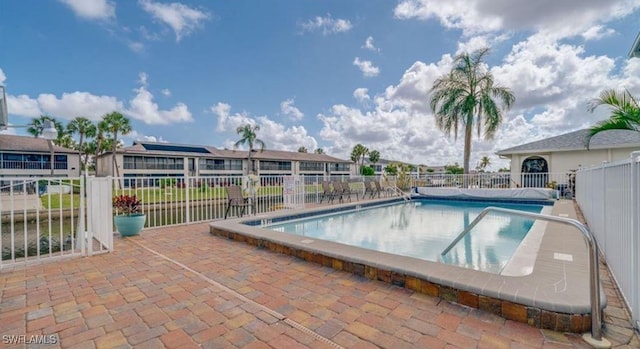 view of swimming pool featuring a patio