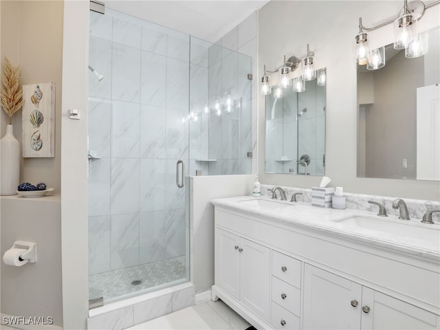 bathroom featuring vanity and a shower with door