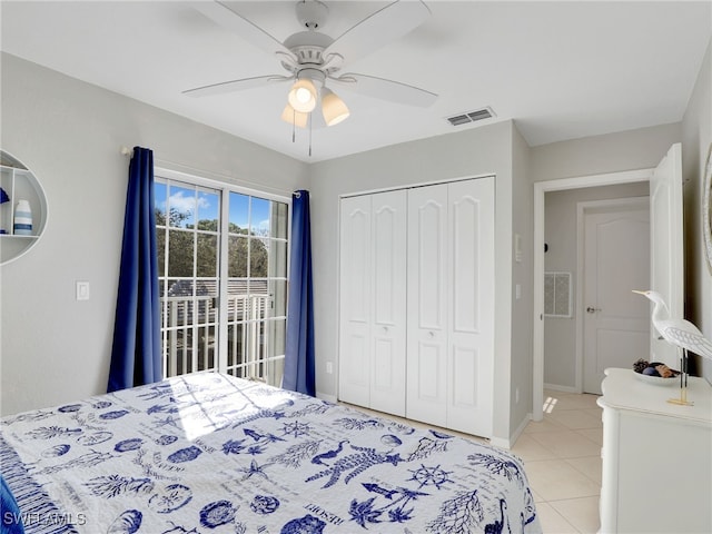 tiled bedroom with ceiling fan, access to exterior, and a closet