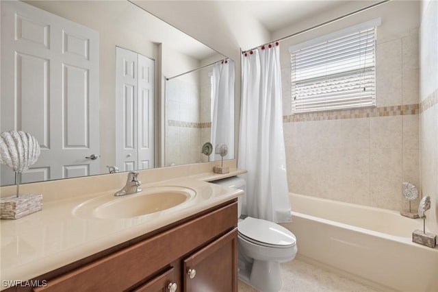 full bathroom featuring shower / bath combo, vanity, and toilet