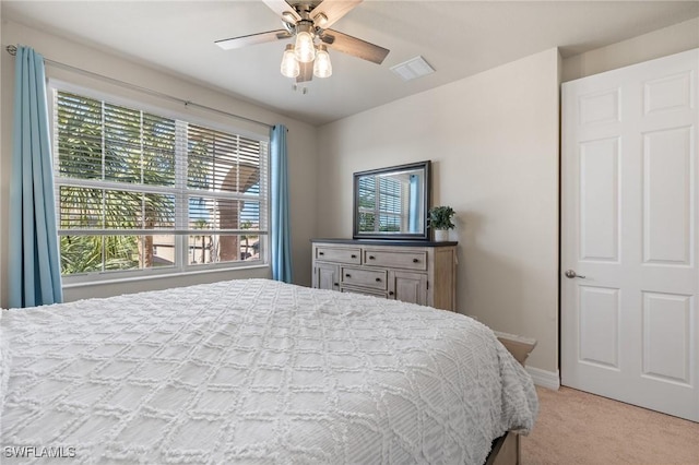 carpeted bedroom with ceiling fan