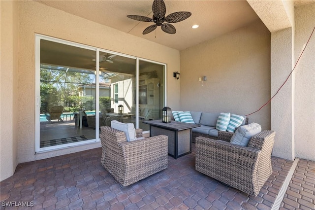 view of patio with outdoor lounge area and ceiling fan