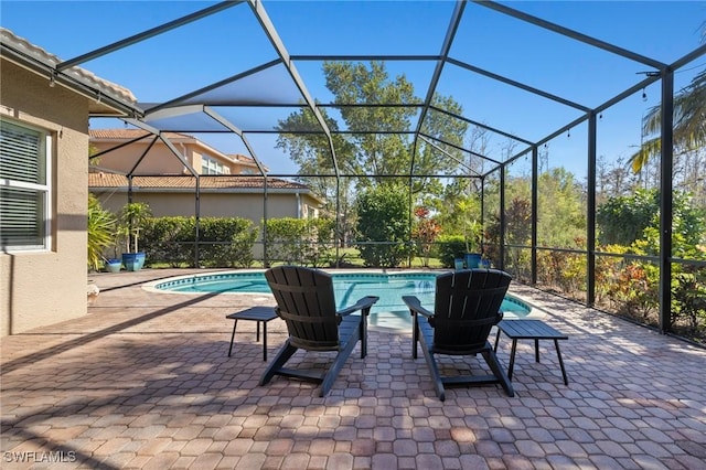 view of pool featuring a lanai and a patio area