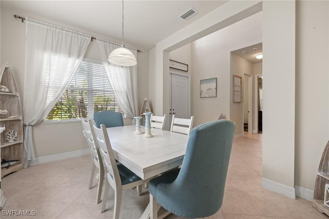 dining room featuring light tile patterned flooring